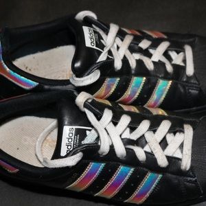 Black and holographic Adidas superstars